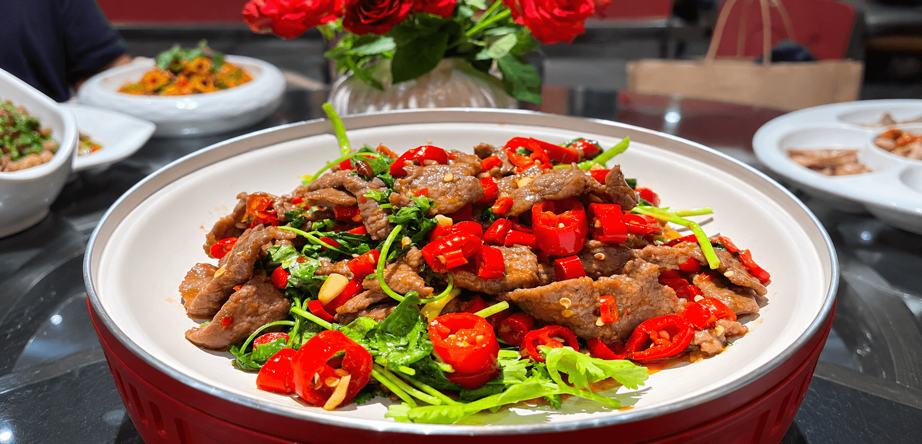 A dish at ChengDu Restaurant with red chillies and coriander