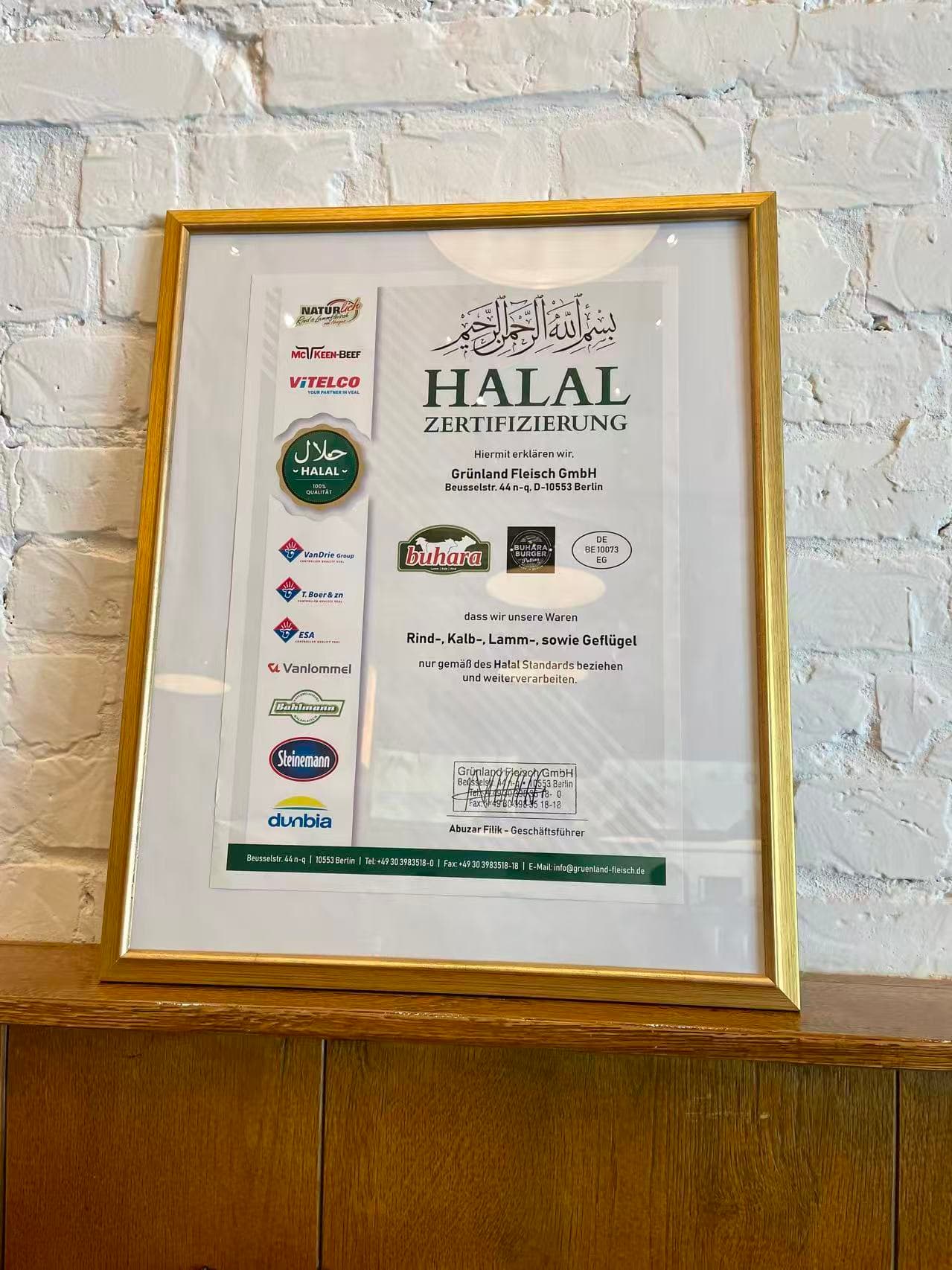 The halal certificate displayed inside Chen's, issued by its meat supplier Grünland Fleisch