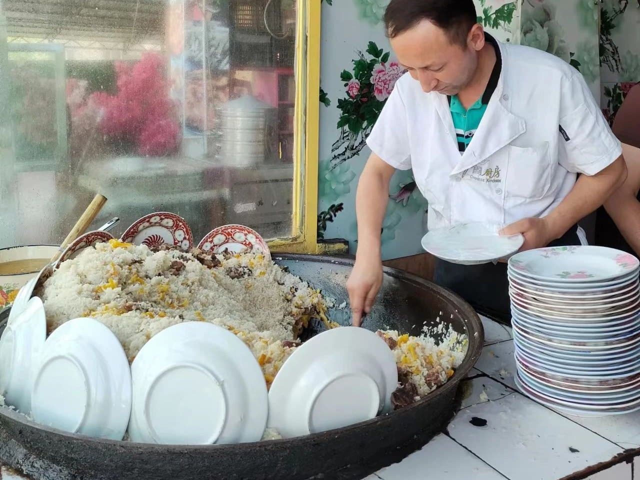 Xinjiang hand pilaf: rice, lamb and carrot steamed in a huge pan, served fresh by the cook