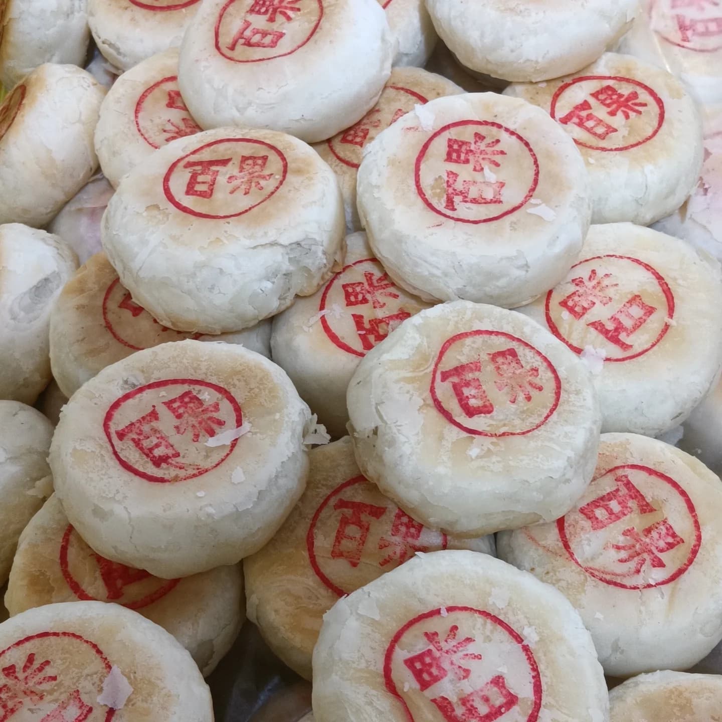 Suzhou-style ginkgo mooncakes with white flaky pastry and red stamps